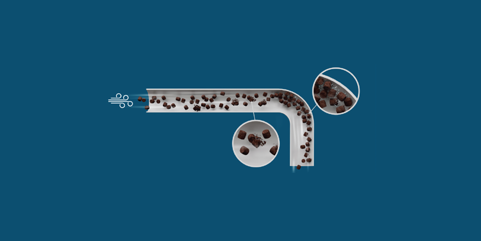 Air-based feed transport showing pellets colliding inside a pipe